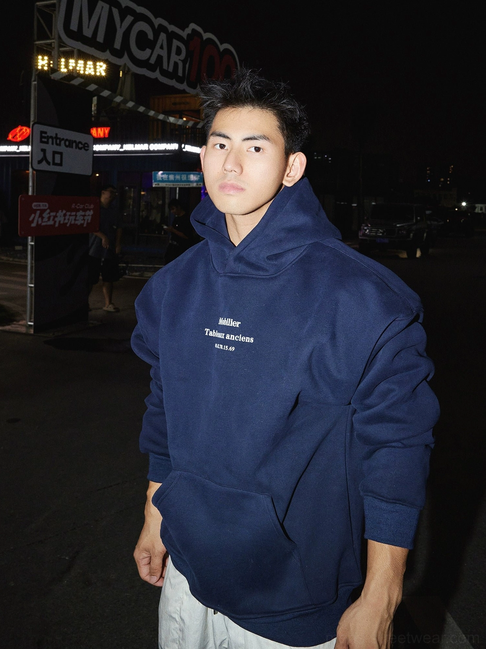 Navy blue minimal text graphic pullover hoodie with loose fit and matching chest lettering for urban streetwear