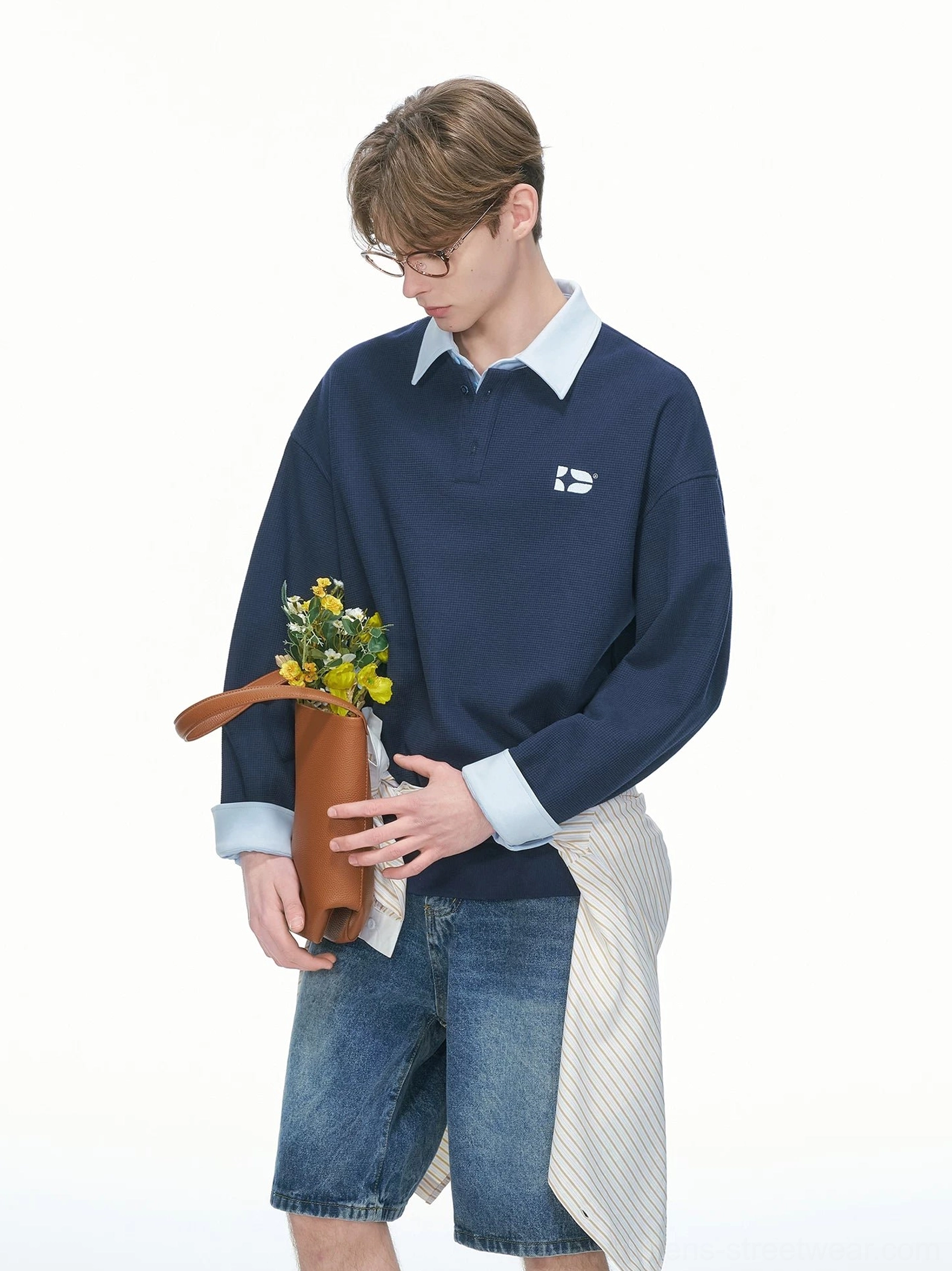 Navy blue oversized rugby sweatshirt styled with a light blue shirt layer dark cuffs and casual Korean streetwear denim shorts