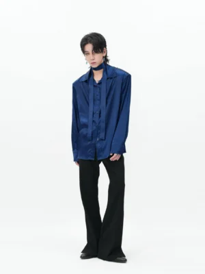Navy blue satin button-up shirt shown in a full front view on a male model against a white studio background, styled with black flared trousers in a Korean streetwear outfit