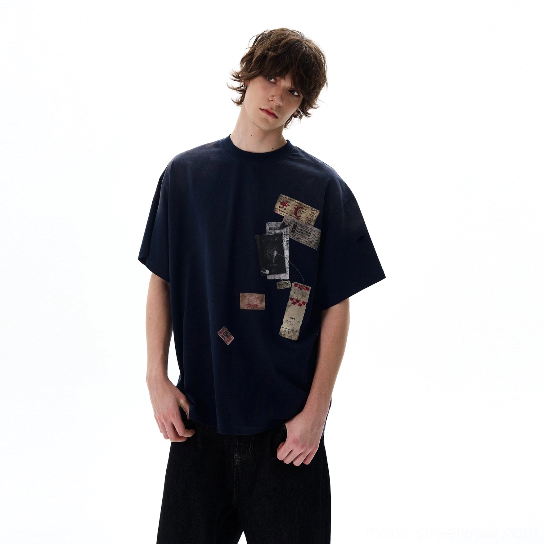 Navy blue oversized travel graphic T-shirt with vintage passport stamp artwork and contemporary East Asian streetwear styling