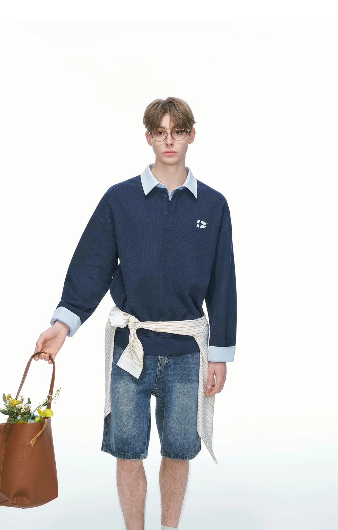 Navy blue varsity collar rugby sweatshirt in a loose casual streetwear silhouette with contrast cuffs and embroidered chest detail