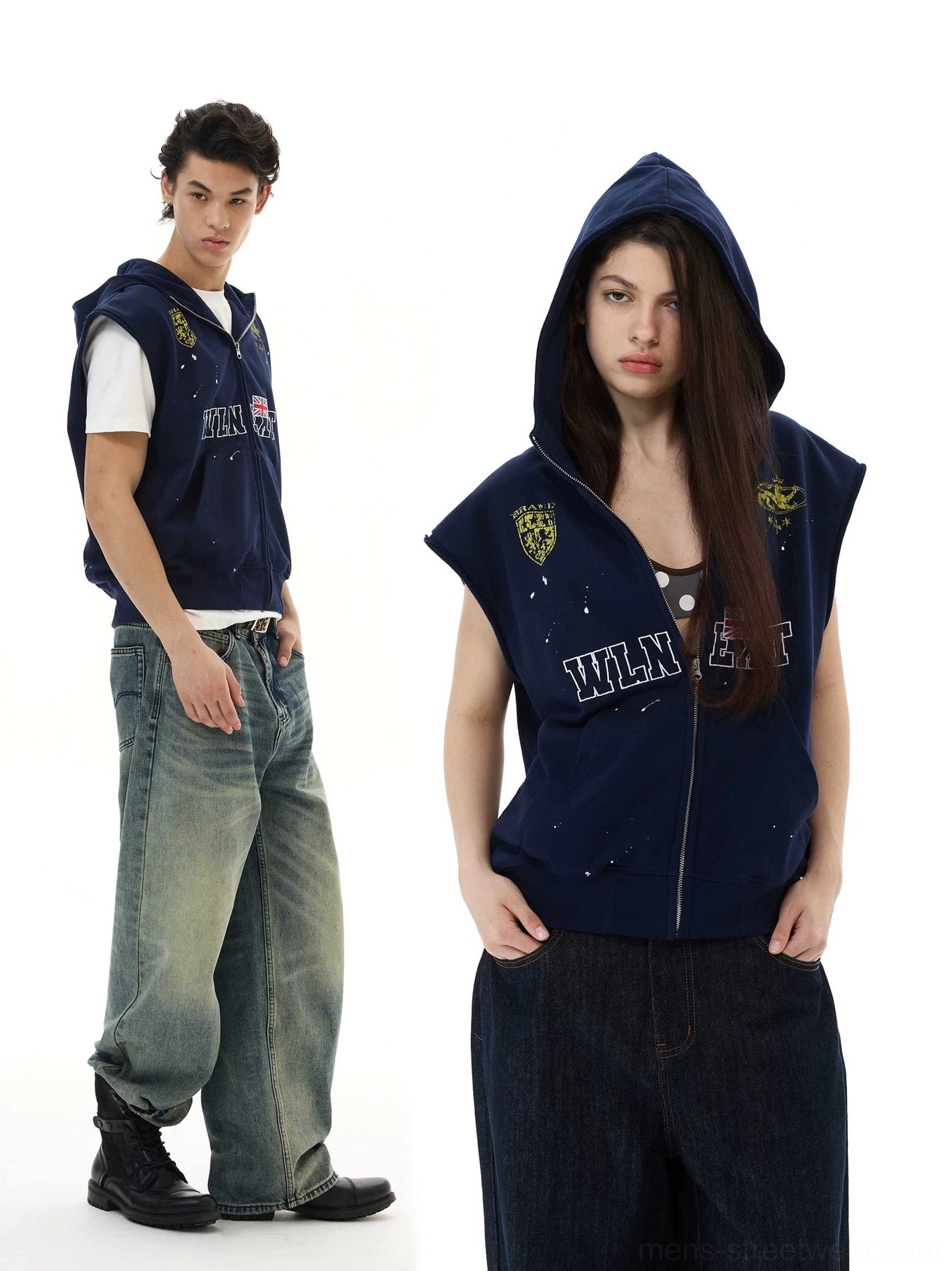 Navy collegiate crest sleeveless zip hoodie vest shown on male and female models in layered streetwear outfits