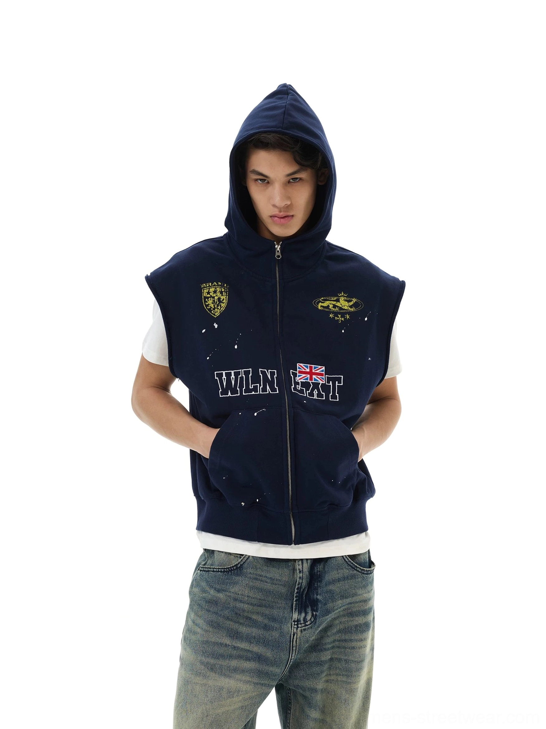 Male model wearing navy collegiate crest sleeveless zip hoodie vest with hood up and front kangaroo pockets