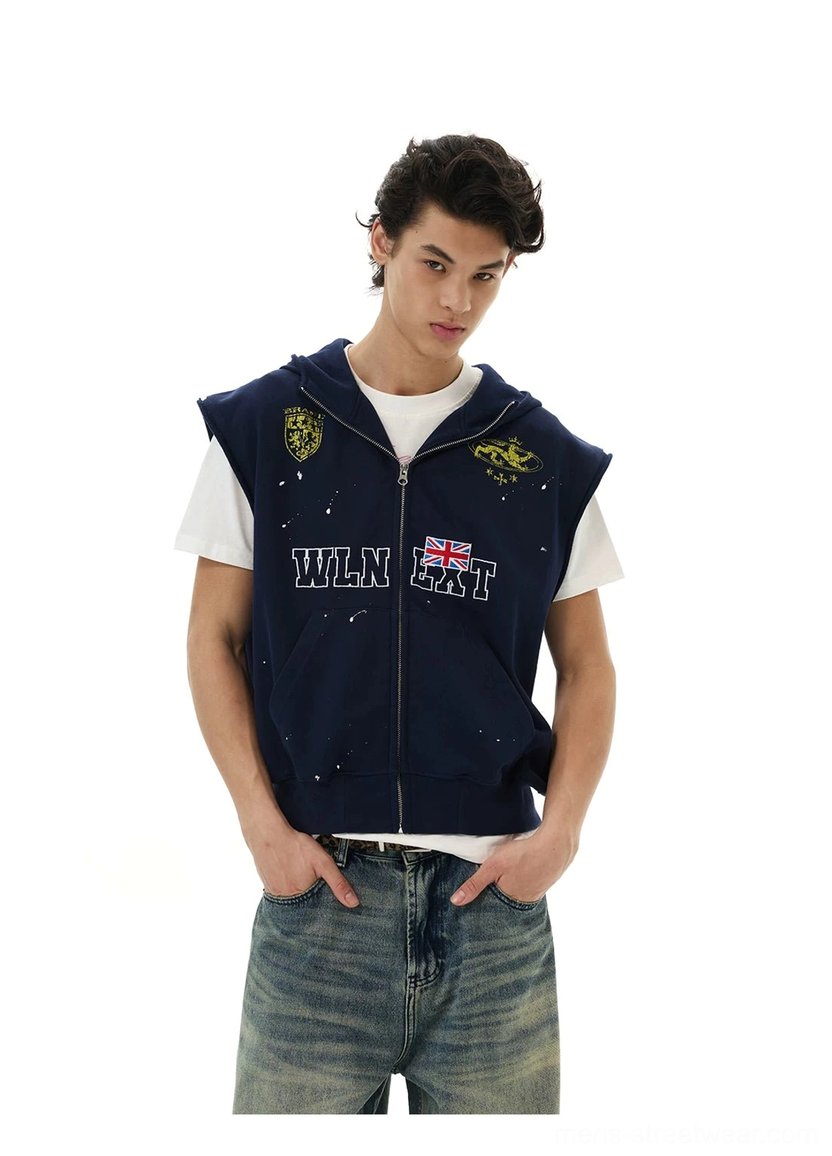 Male front view of navy collegiate crest sleeveless zip hoodie vest showing hood pockets patches and lettering