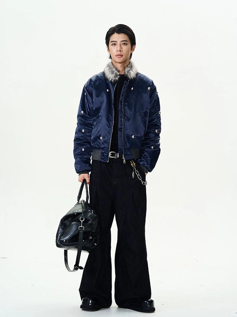 Full front view of a navy faux fur collar bomber jacket with silver studs styled as contemporary Korean streetwear