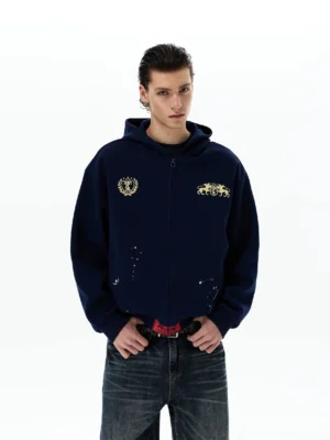 Navy heraldic horse crest oversized zip-up hoodie front half-body view with gold chest emblems