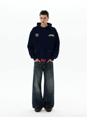 Navy oversized heraldic horse crest zip-up hoodie full front view styled with wide-leg jeans