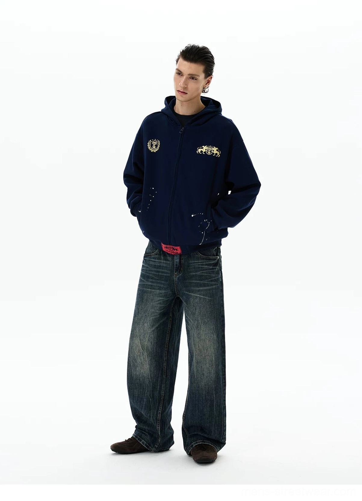 Navy oversized horse crest zip-up hoodie three-quarter side view with baggy denim styling
