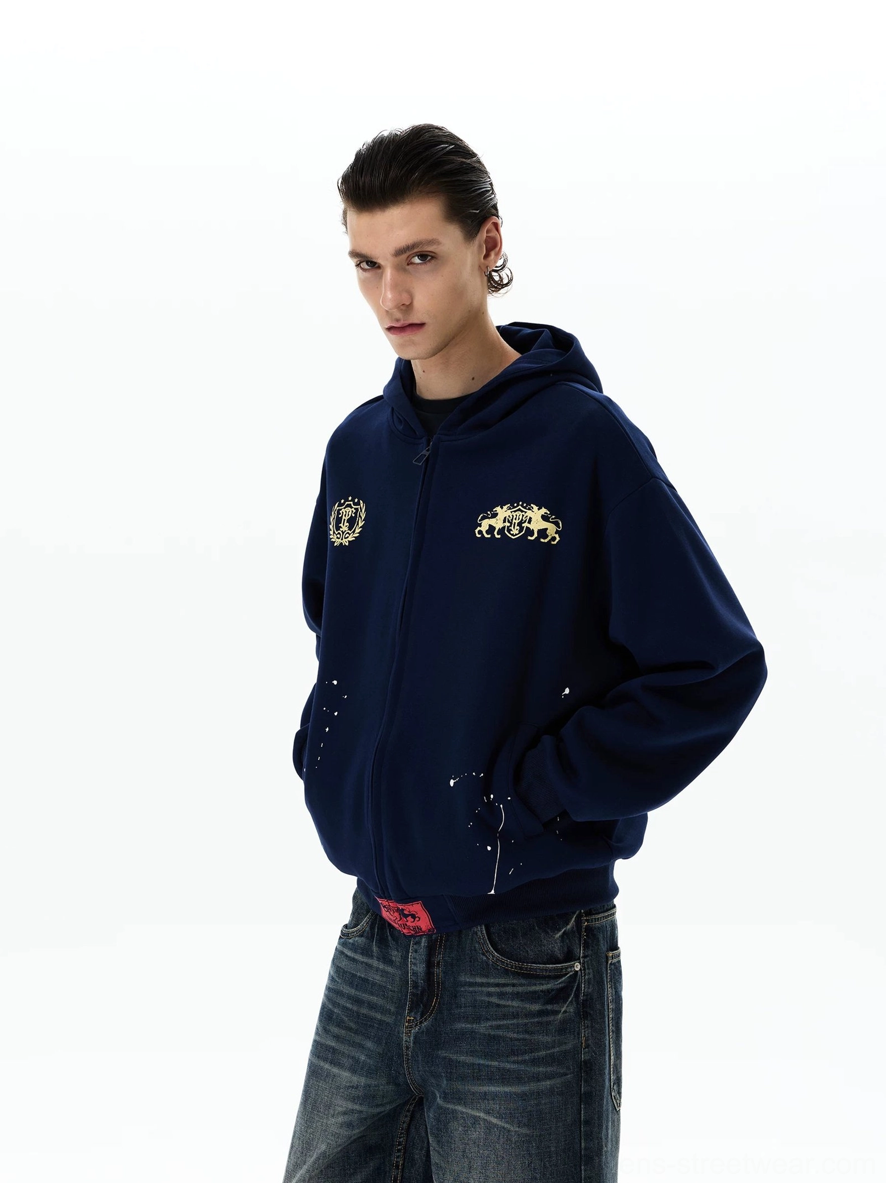 Navy graphic zip-up hoodie side three-quarter view showing relaxed oversized streetwear fit