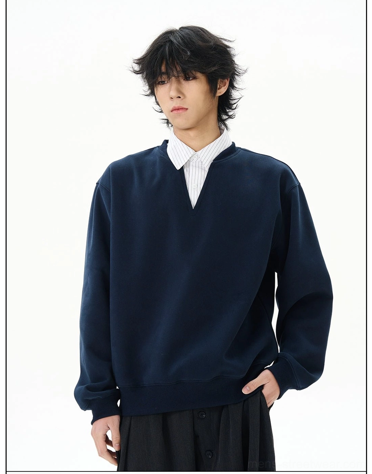 Close front torso view of navy notch-neck sweatshirt showing striped layered collar detail and smooth solid fabric texture