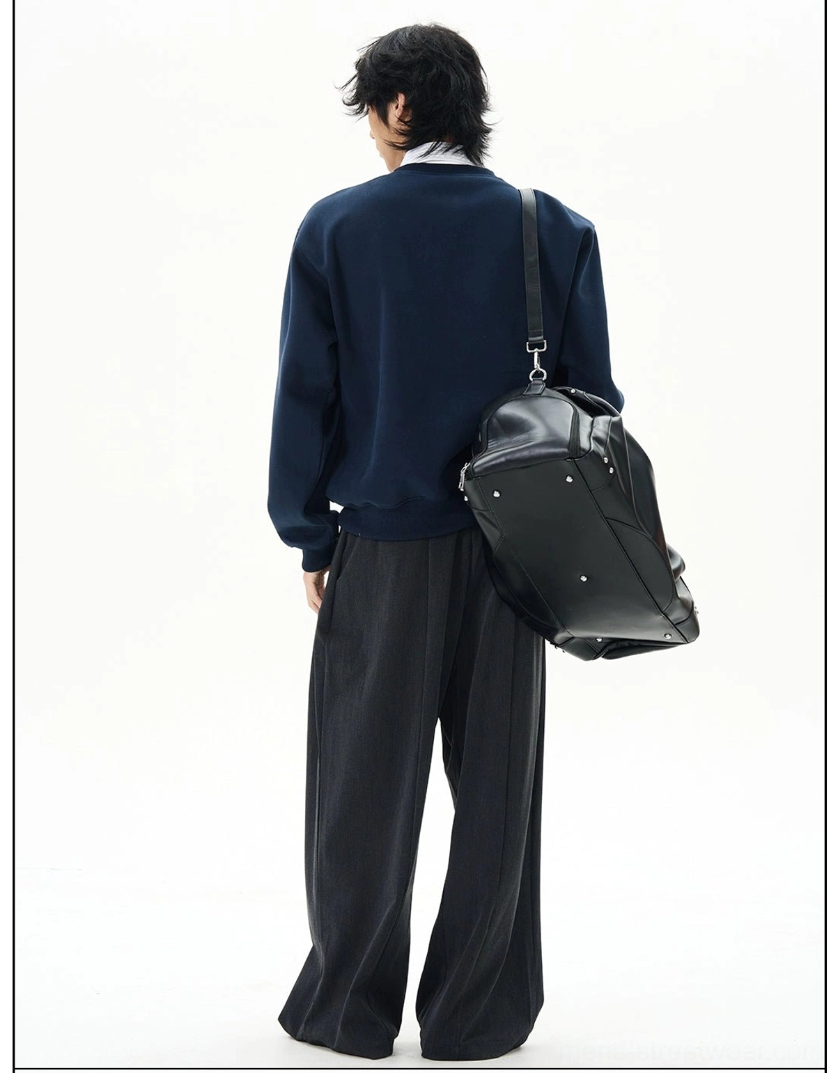 Back three-quarter view of a navy oversized sweatshirt with ribbed hem, relaxed shoulders, and contemporary Seoul streetwear styling