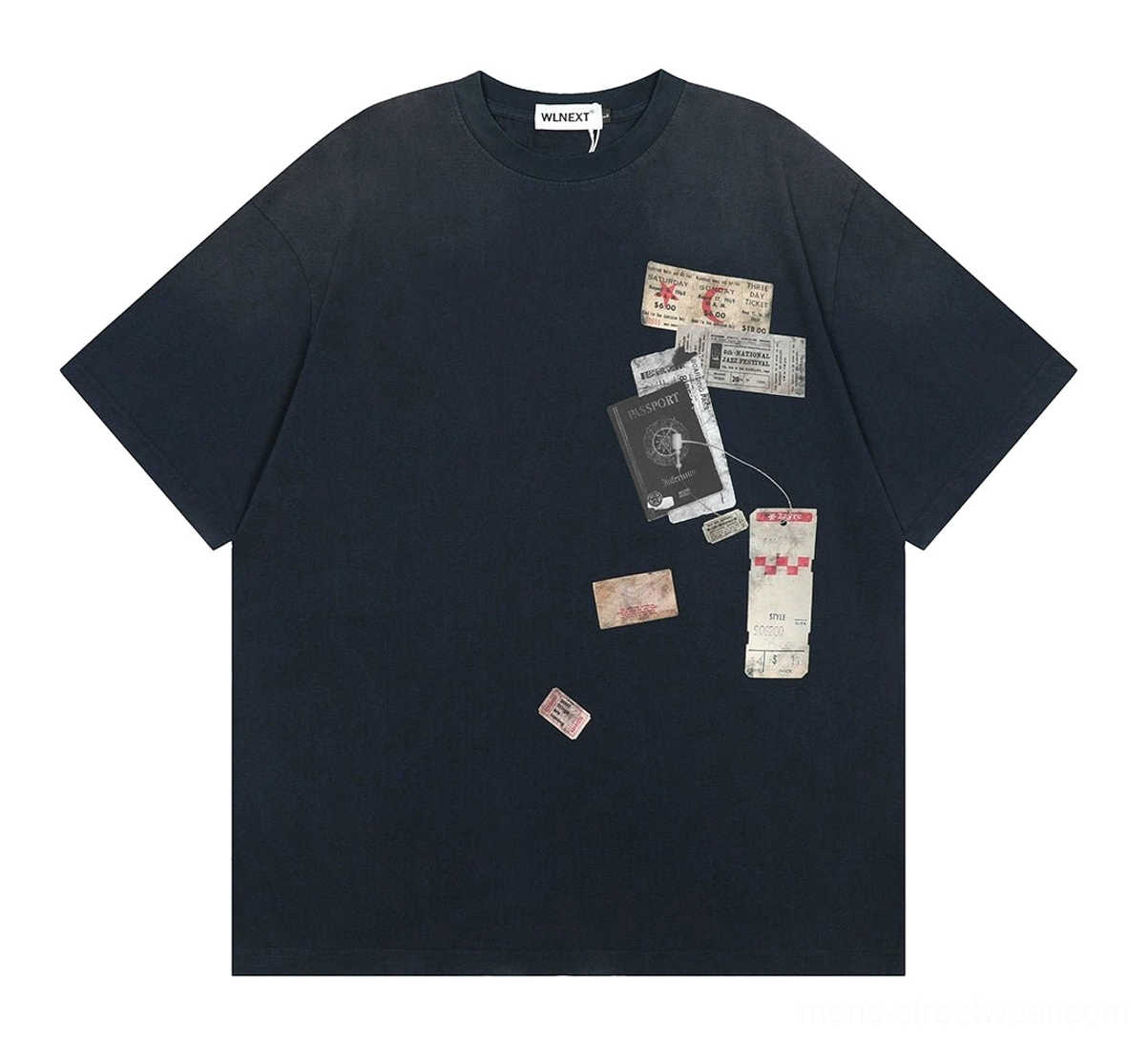 Navy oversized passport and luggage tag graphic T-shirt displayed flat with scattered vintage travel-inspired prints