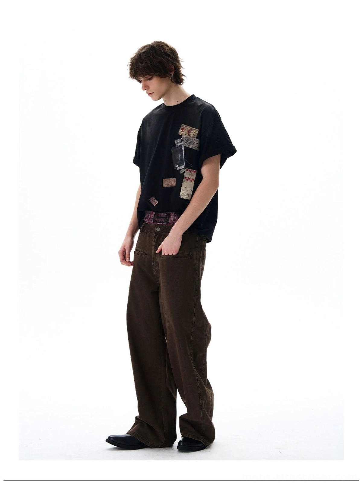 Side view of navy passport stamp oversized tee showing the relaxed Korean streetwear silhouette and loose fit