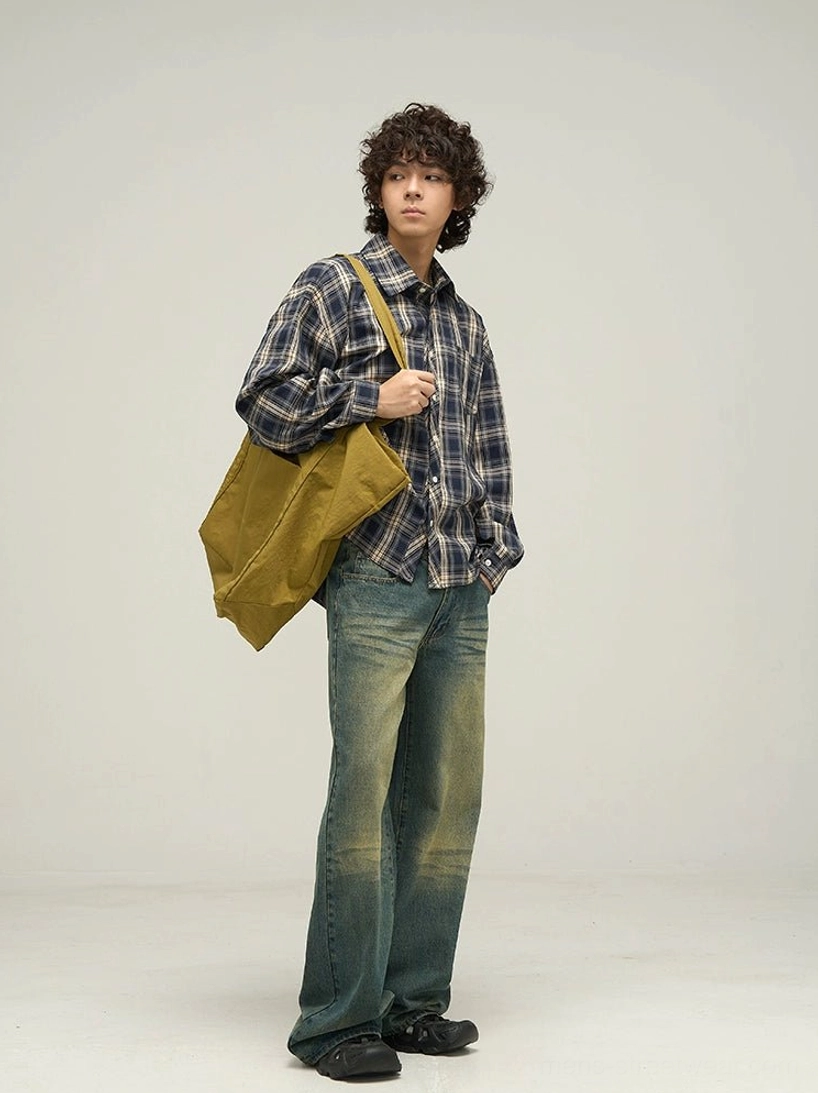Side view of navy tartan relaxed fit button-up shirt with spread collar and curved hem for Korean streetwear styling