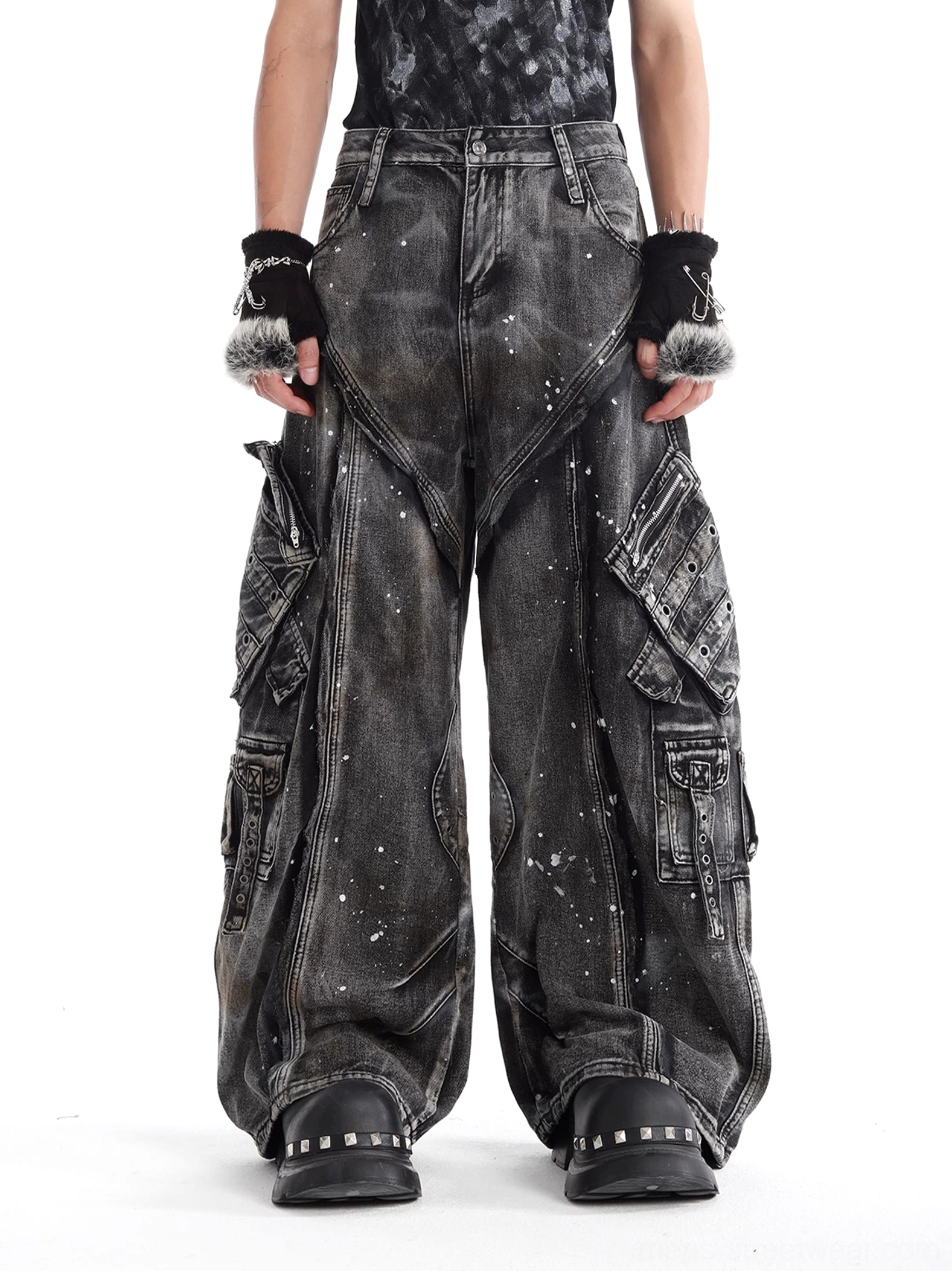 Front full-body view of gray distressed wide-leg cargo denim jeans with acid wash splatter finish and oversized utility pockets