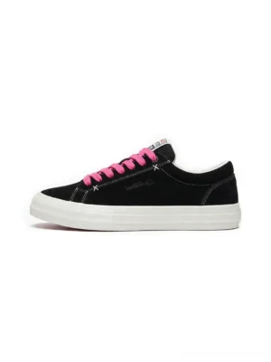 Black suede platform sneakers with bright neon pink laces shown in a clean side profile for Korean streetwear styling