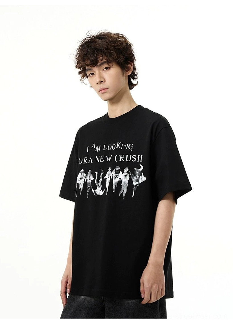 Close torso view of the black New Crush oversized graphic t-shirt featuring vintage figure artwork and lettering