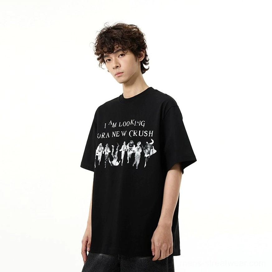 Male model wearing the black New Crush vintage graphic oversized t-shirt in a relaxed Korean streetwear outfit