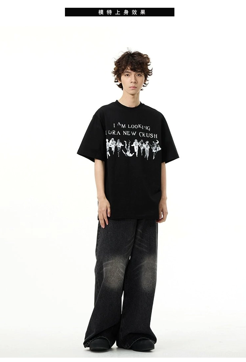 Male model wearing the black New Crush vintage graphic streetwear t-shirt with faded black baggy jeans