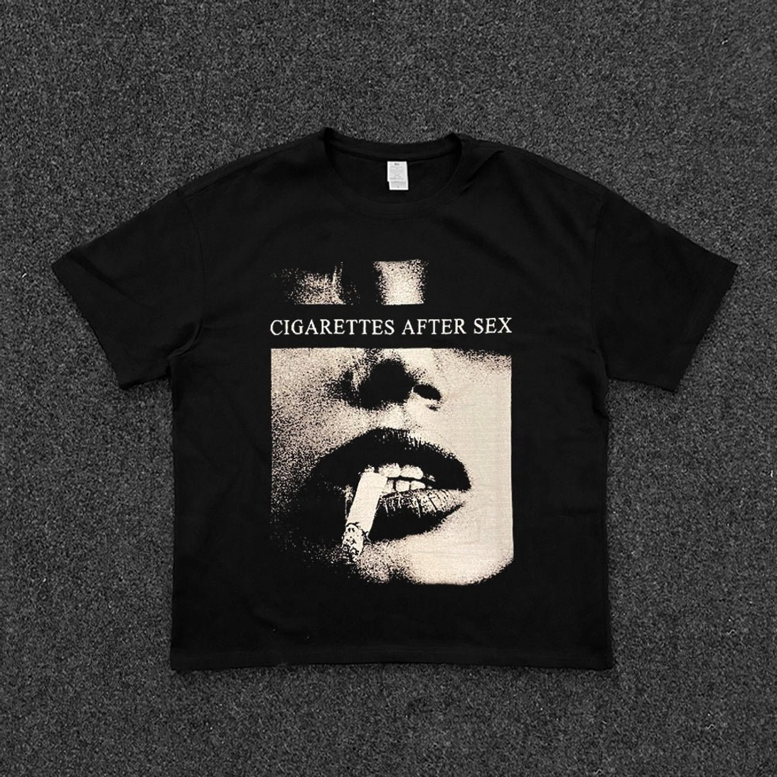 Black unisex graphic T-shirt with retro halftone smoking lips print and bold lettering, relaxed cropped boxy fit, short sleeves, and Korean-inspired streetwear styling