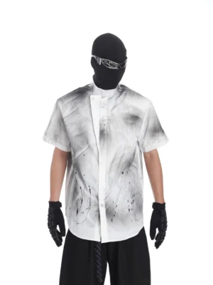 Front view of a black and grey gradient splatter shirt with stand collar, short sleeves, button front, and white paint details for Korean streetwear styling