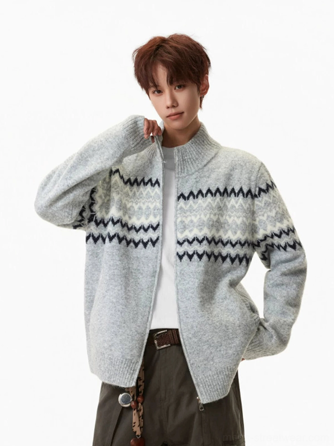 Side three-quarter view of gray Nordic pattern knit zip cardigan with brushed texture, ribbed stand collar, and jacquard sleeve detail
