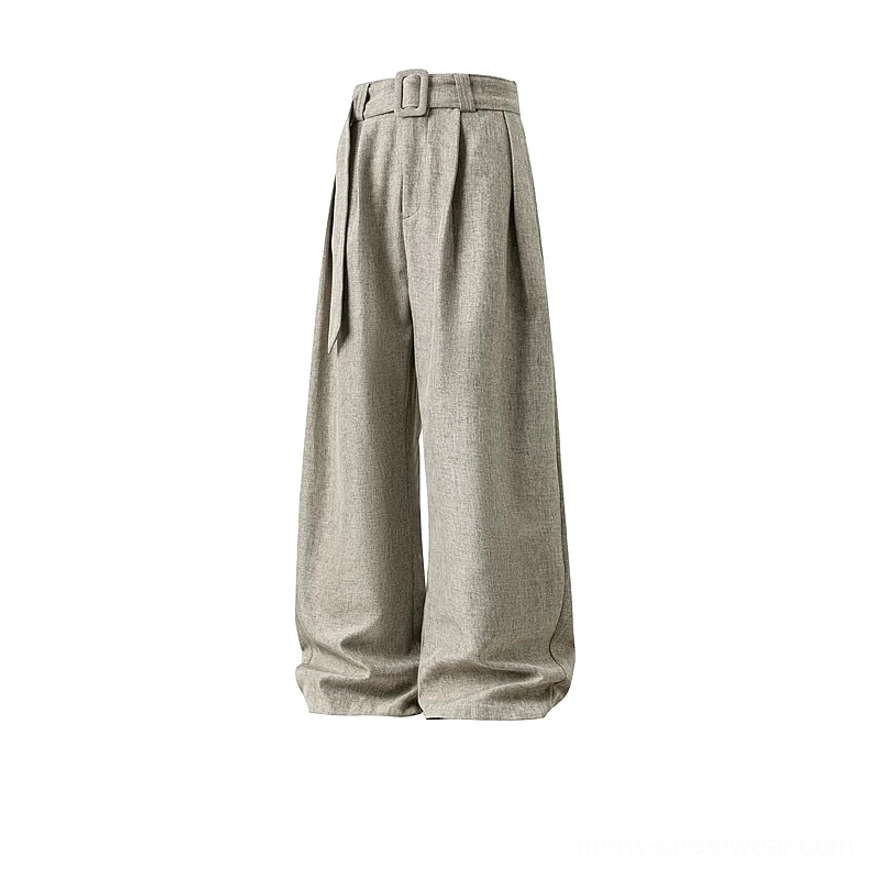Flat product view of light oatmeal beige linen-texture wide-leg trousers with matching belt, front pleats, and relaxed curved shaping