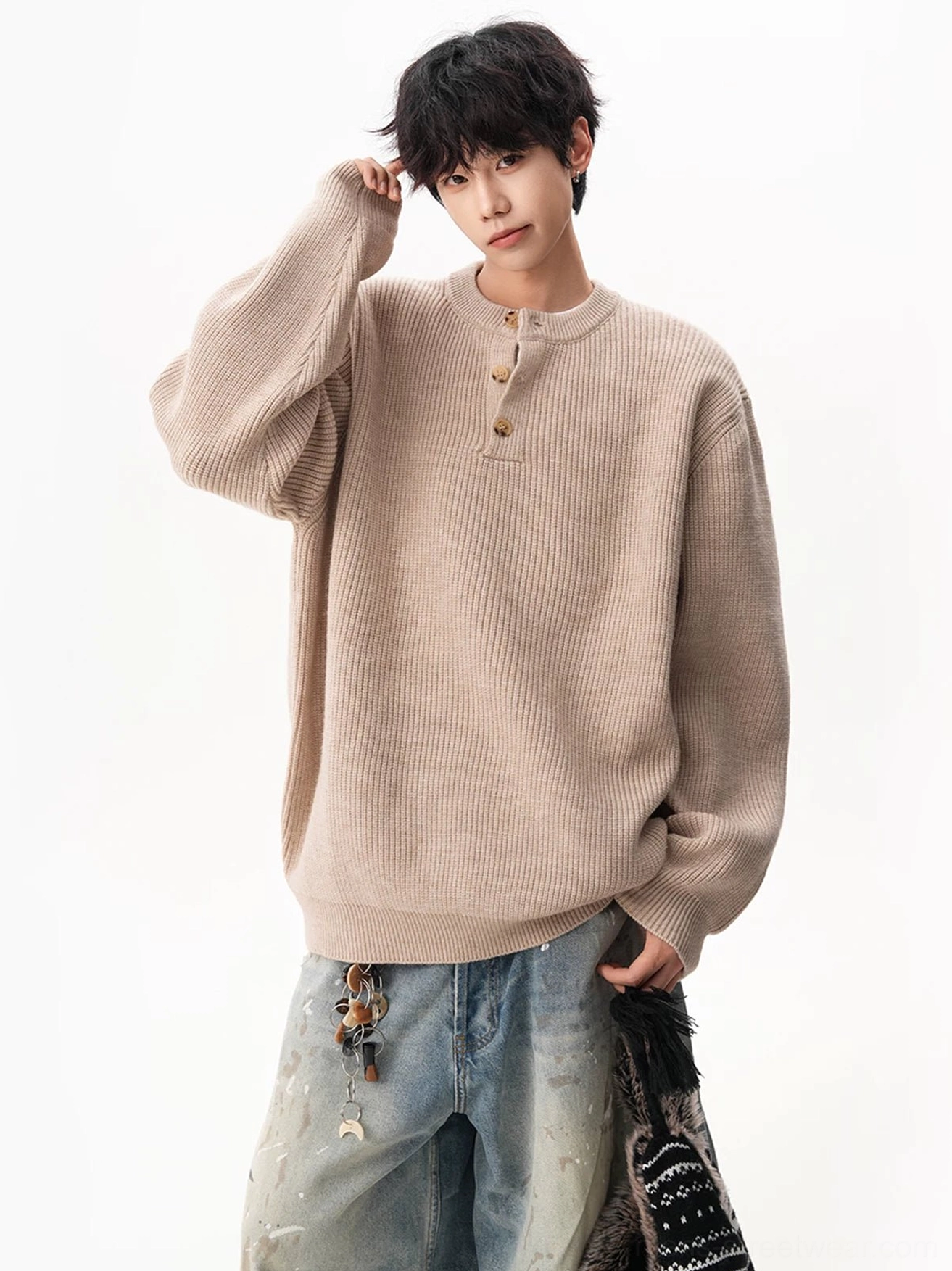 Oatmeal beige waffle Henley knit sweater with relaxed fit styled with distressed denim and a patterned tote bag