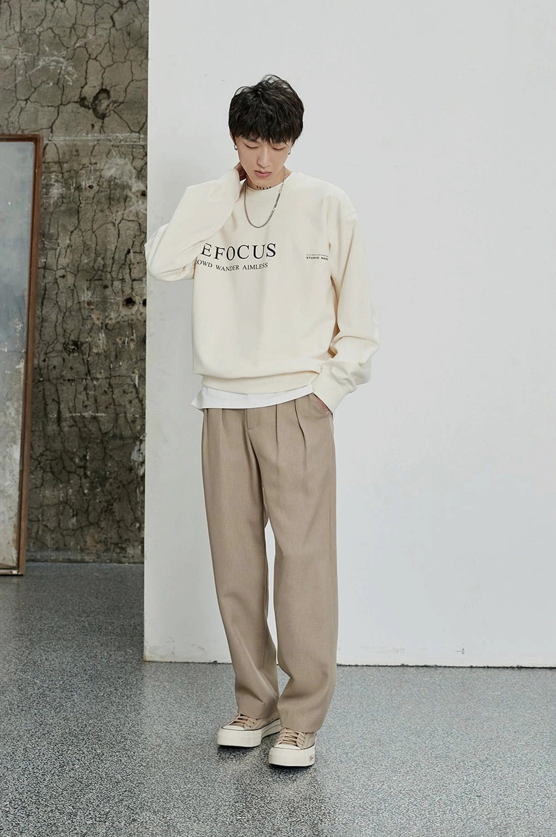 Oatmeal wide-leg dress pants with double pleats styled in a relaxed smart casual outfit