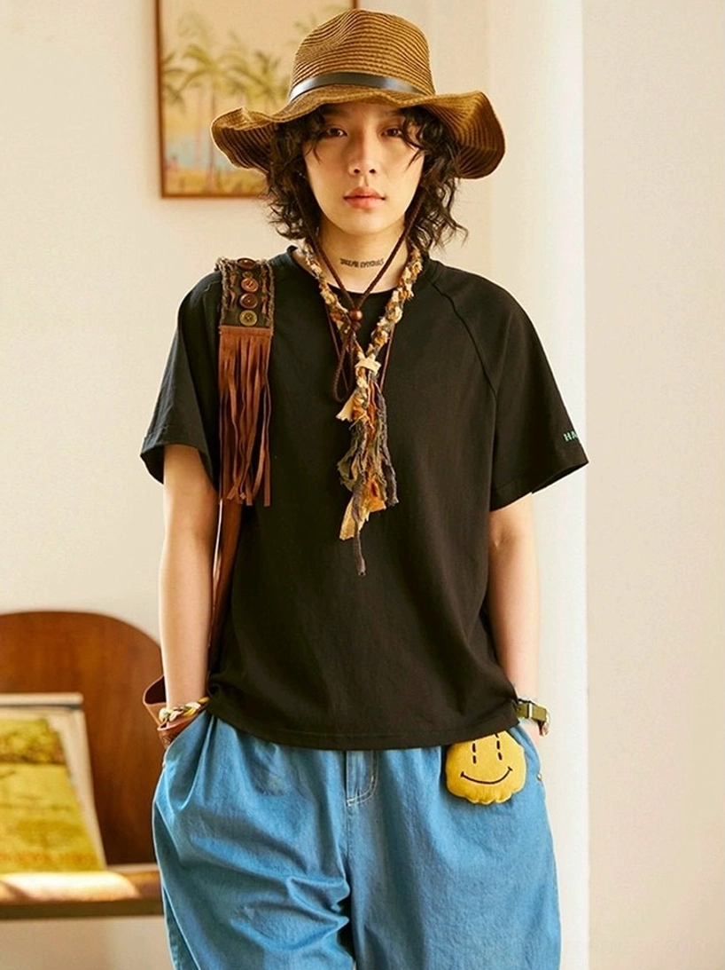 Obsidian black cotton raglan T-shirt with relaxed Korean streetwear fit and layered crew neck detail