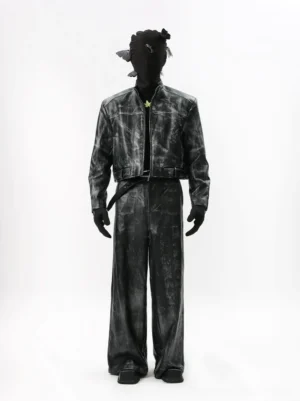 Front view of a faded black distressed leather moto outfit featuring a cropped zip jacket, stand collar, high waisted wide leg trousers, matching belt, and Korean streetwear styling