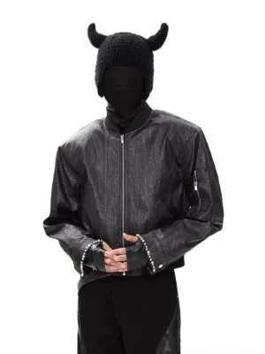 Front view of the Obsidian Flux black distressed PU bomber jacket featuring a cropped boxy silhouette, metal front zipper, ribbed collar, and studded cuffs