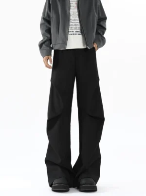 Black super balloon wide leg trousers with folded front pleats shown in front three quarter streetwear outfit view