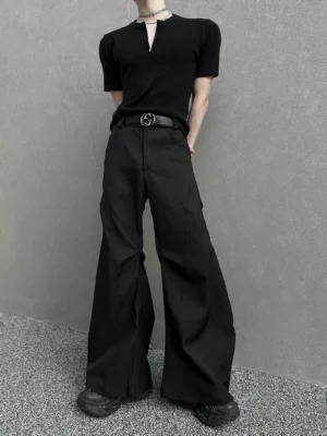 Front view of black hyperwide flare cargo trousers featuring clean tailored seams, high-waisted construction, exaggerated wide legs, leather belt, and Seoul streetwear styling