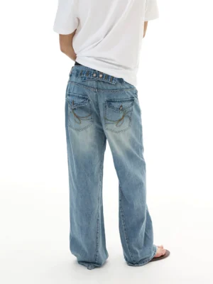 Rear full-body view of vintage wide-leg blue jeans showing embroidered back pockets, faded denim wash, and relaxed oversized Korean streetwear styling
