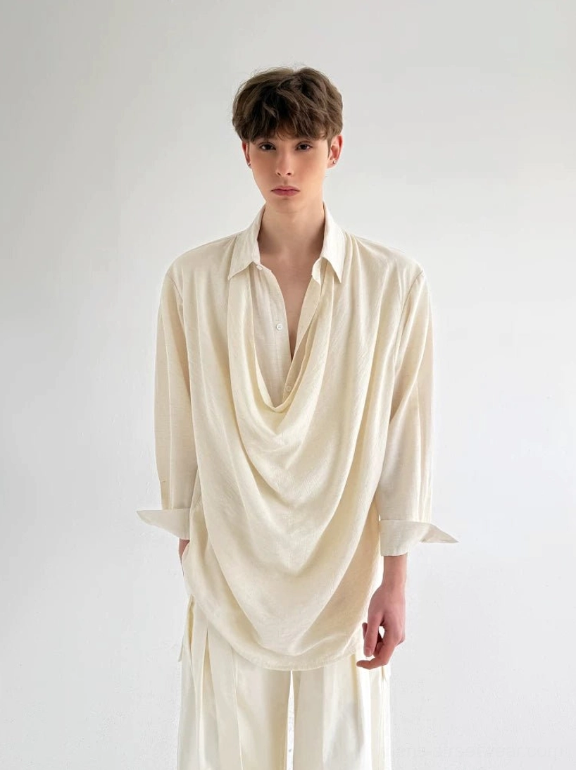 Close-up of men's off-white avant-garde shirt with pointed collar partial button placket and flowing draped front