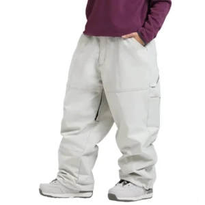 Off-white baggy snow pants with contrast stitching, utility pocket, zippered leg vent, and oversized workwear streetwear silhouette