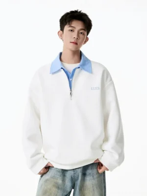 Off-white contrast collar half-zip sweatshirt with light blue collar styled with vintage washed denim jeans