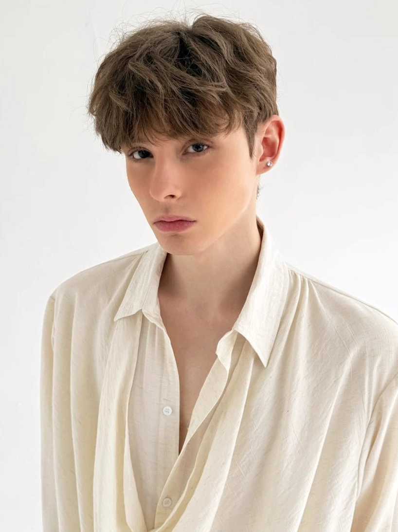 Detailed front view of men's off-white cowl neck shirt with soft linen-like texture and open collar