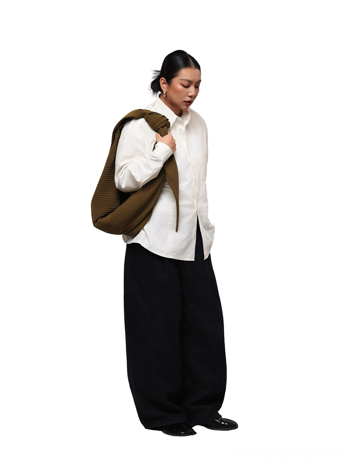 Side view of relaxed off-white embroidered poplin overshirt styled with black wide-leg pants and shoulder bag