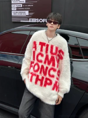 Off-white fuzzy bold red letter graphic crewneck sweater in Korean streetwear style worn beside black sedan