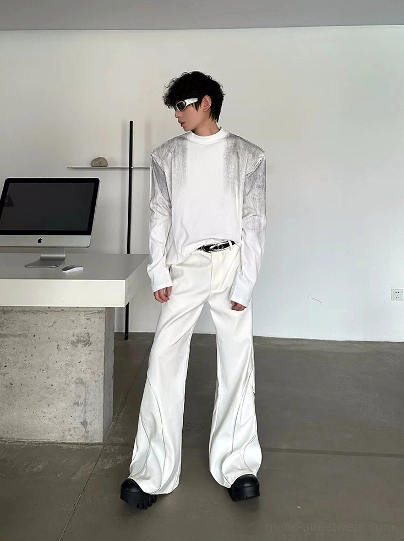 Off-white high-waisted sculptural wide-leg trousers shown from the front with tailored waistband, extra-long silhouette, and leather belt styling