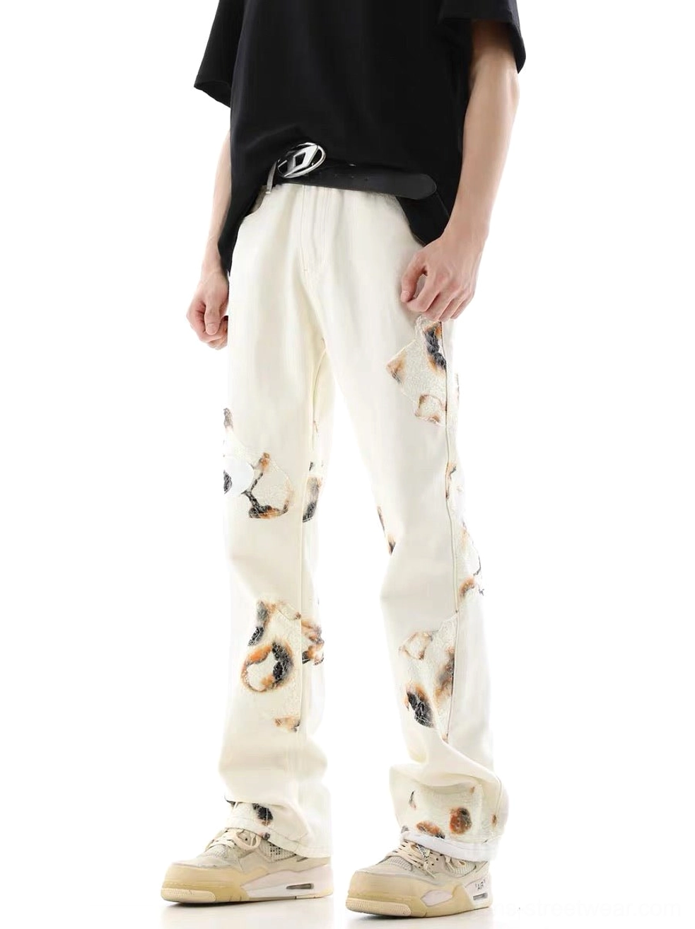 Side front view of male model styling off-white lace panel wide-leg denim jeans in Korean streetwear outfit