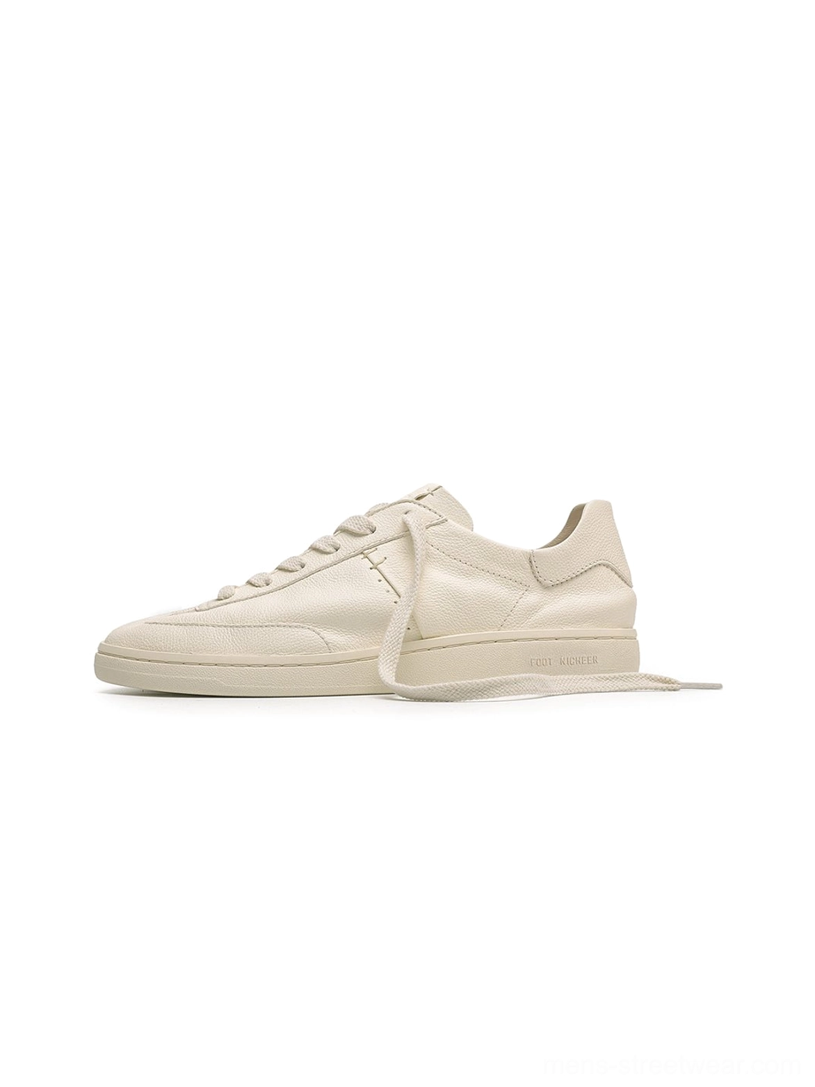 Off-white low-profile cowhide leather sneakers shown in a clean side view with a minimalist lace-up silhouette and flat streetwear design