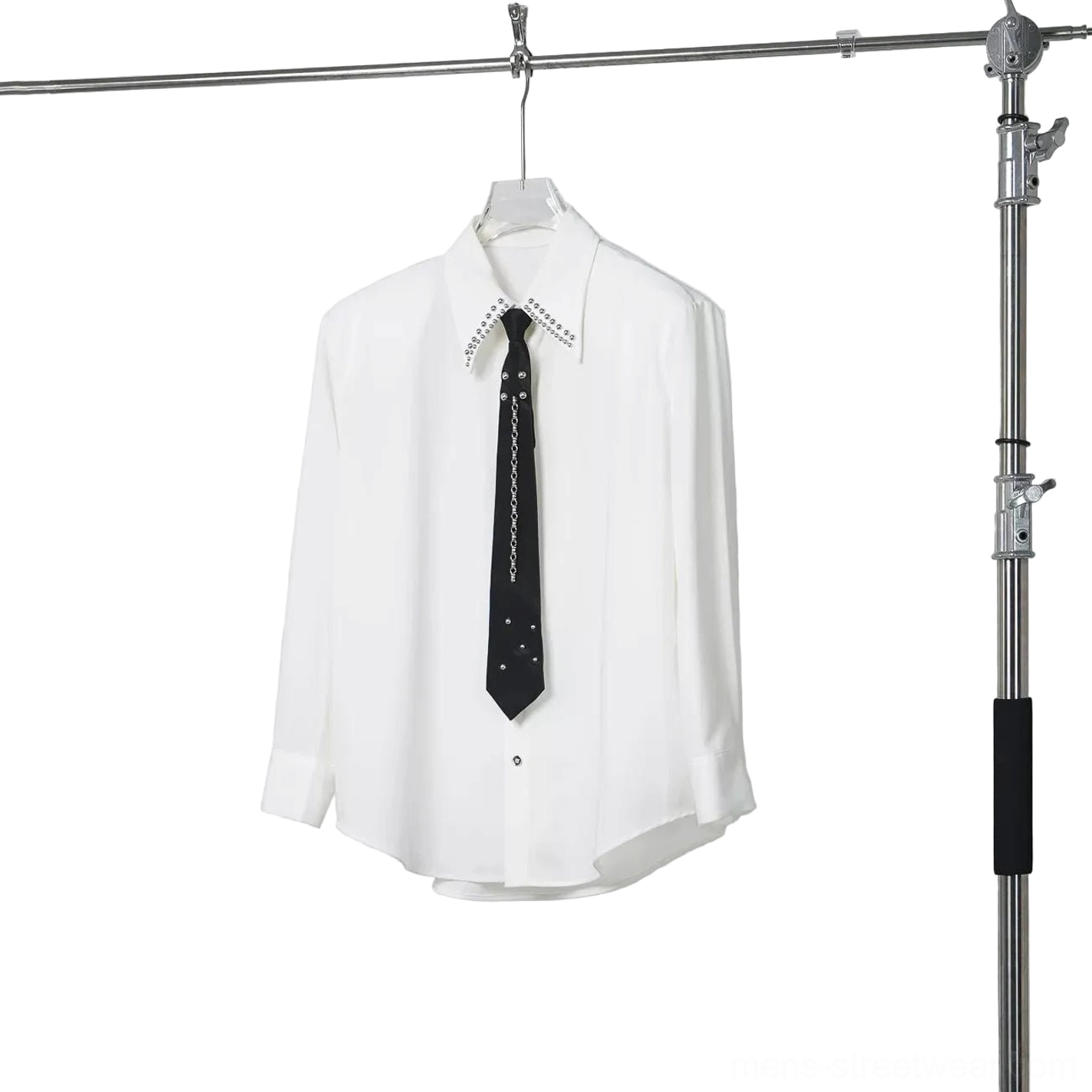 Off-white oversized long-sleeve shirt with crystal studded collar and black chain tie hanging studio view