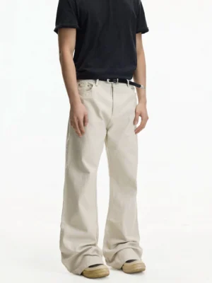 Off-white relaxed wide leg jeans front three-quarter view styled with black t-shirt and casual shoes