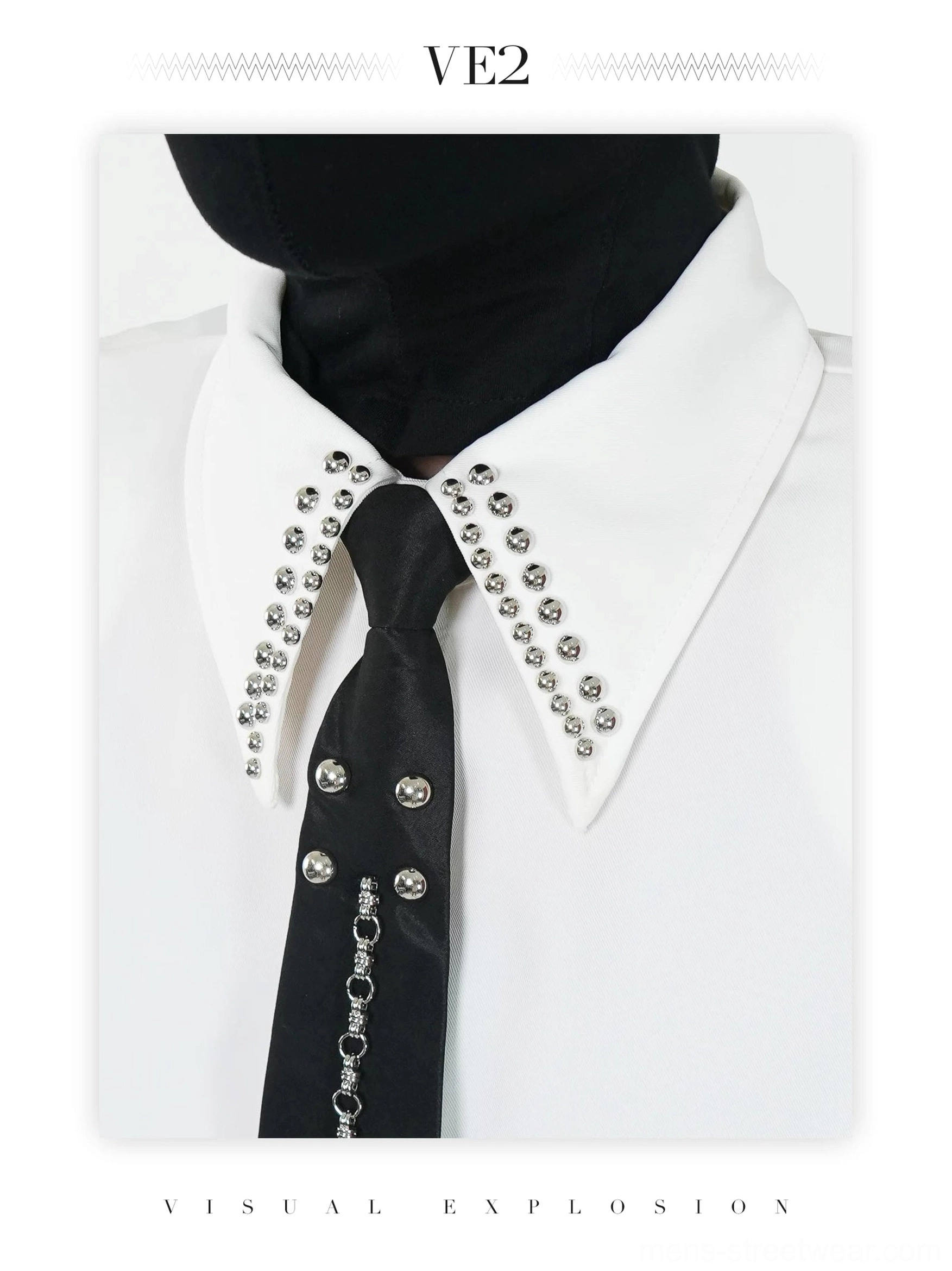 Close-up detail of off-white shirt crystal studded pointed collar and black chain embellished tie