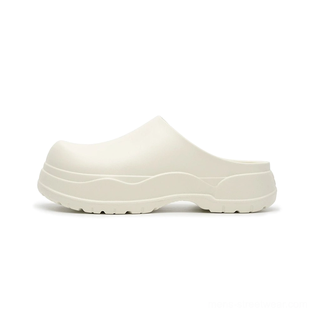 Off-white slip-on platform clogs with smooth matte upper, rounded closed toe, layered thick sole, and minimalist neutral styling