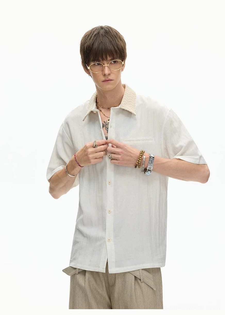 Off white textured collar streetwear shirt with button front styled with layered wrist accessories