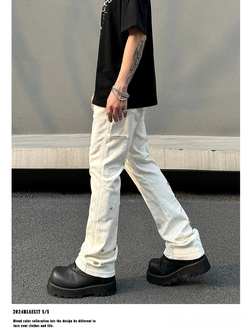 Men's off-white utility flare jeans side walking view highlighting thigh cargo pocket, snap-stud leg panel, and flared hem